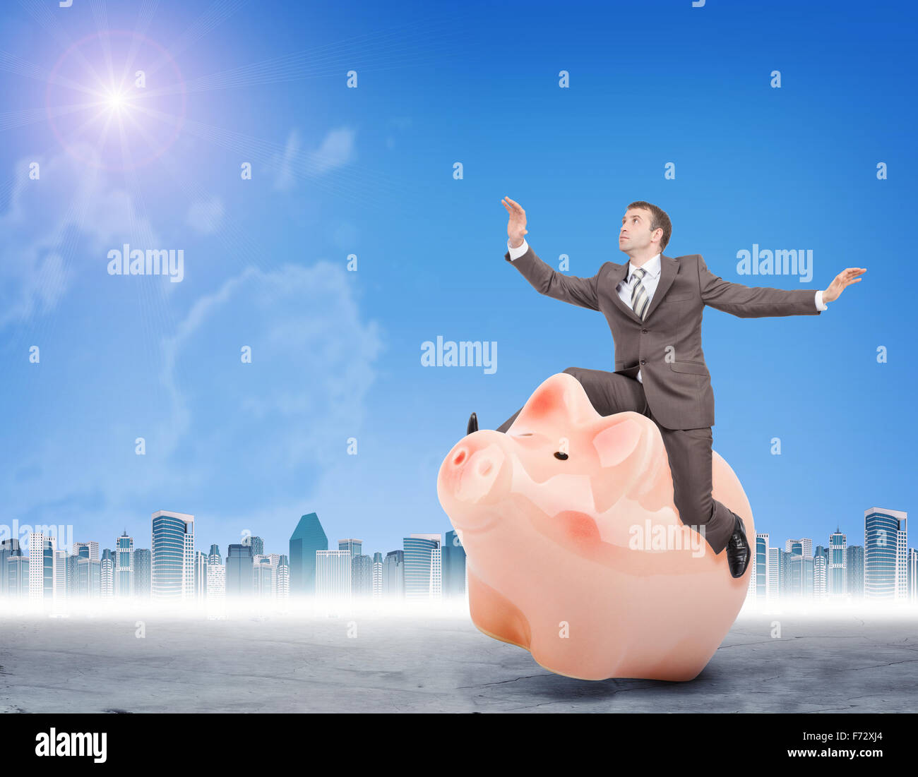 Man in suit sitting on piggy bank Stock Photo - Alamy