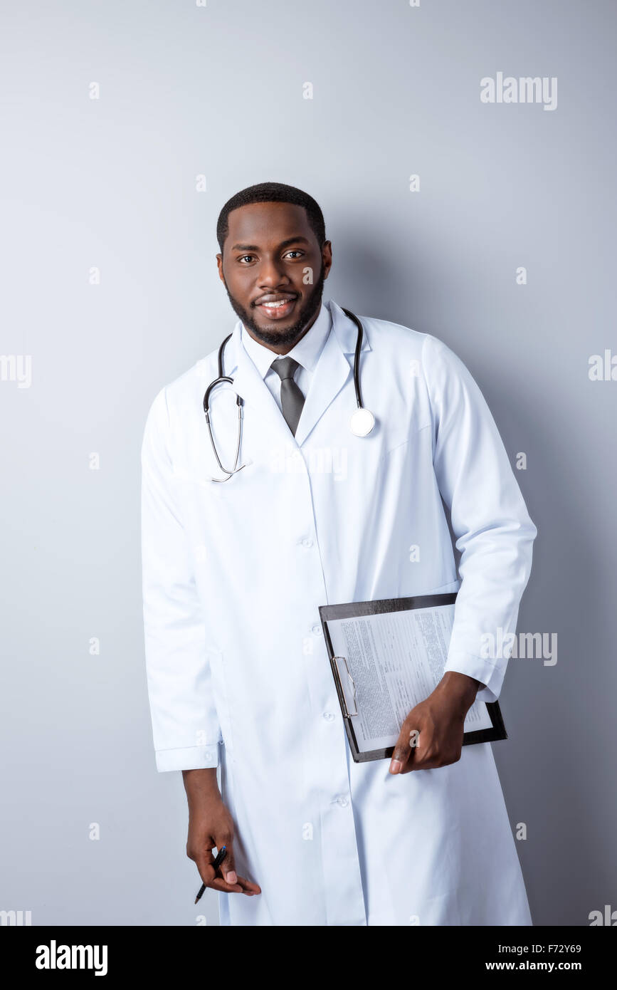 Grey haired doctor smiling hi-res stock photography and images - Alamy
