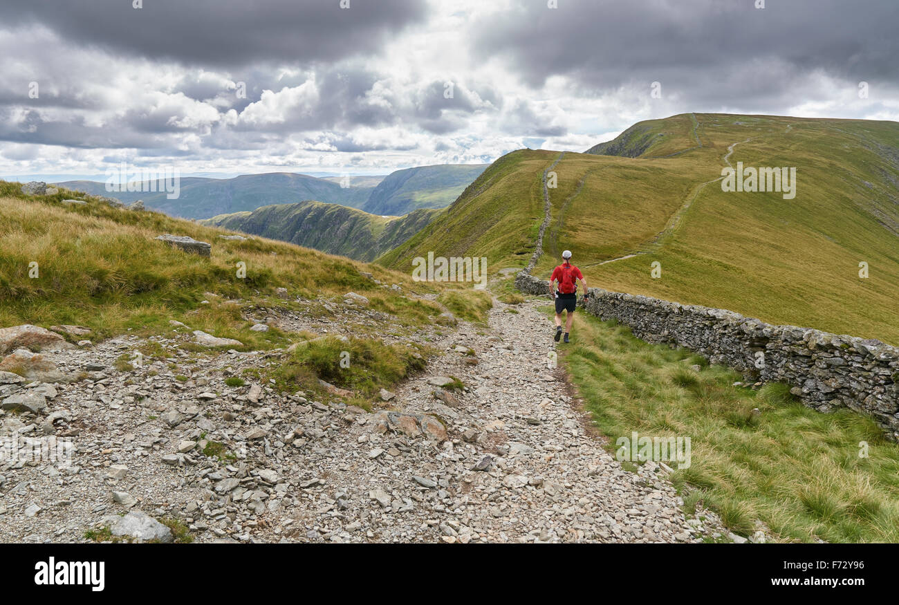 A man fell running down from The Knott and on towards the summit of High Street in the English Lake District, UK. Stock Photo