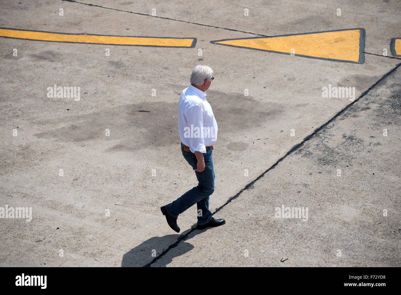 German Foreign Minister Frank-Walter Steinmeier (SPD) walks to his plane to travel on to Entebbe in Uganda, at the airport in Lusaka, Zambia, 21 November 2015. Steinmeier is visiting the four African states of Mozambique, Zambia, Uganda, and Tanzania with a cultural and economic delegation until Sunday, 22 November 2015. Photo: BERND VON JUTRCZENKA/dpa Stock Photo
