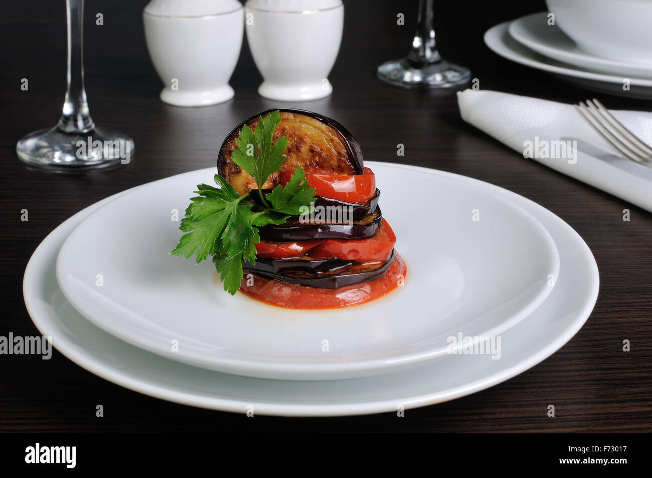 Appetizer of fried eggplant with tomatoes, parsley Stock Photo Alamy