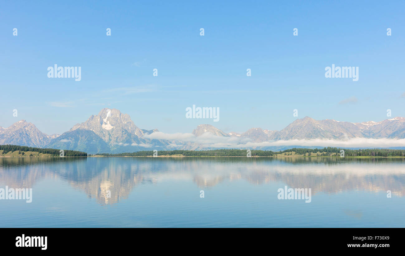 Jenny Lake with the Grand Tetons in the background on a fine morning in summer near Jackson, Wyoming, USA. Stock Photo
