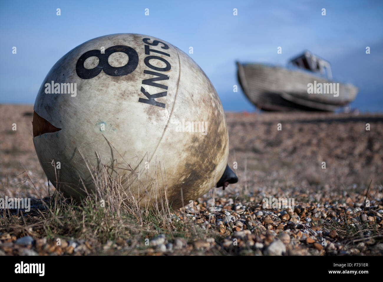8 Knots warning buoy on shingle beach at Dungeness, Kent, England, UK Stock Photo