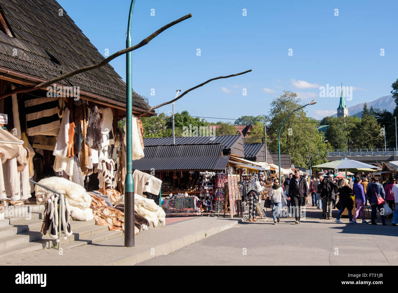 Stalls selling furs and skins in market on busy Krupowki Street, Zakopane, Tatra County, Poland, Europe Stock Photo