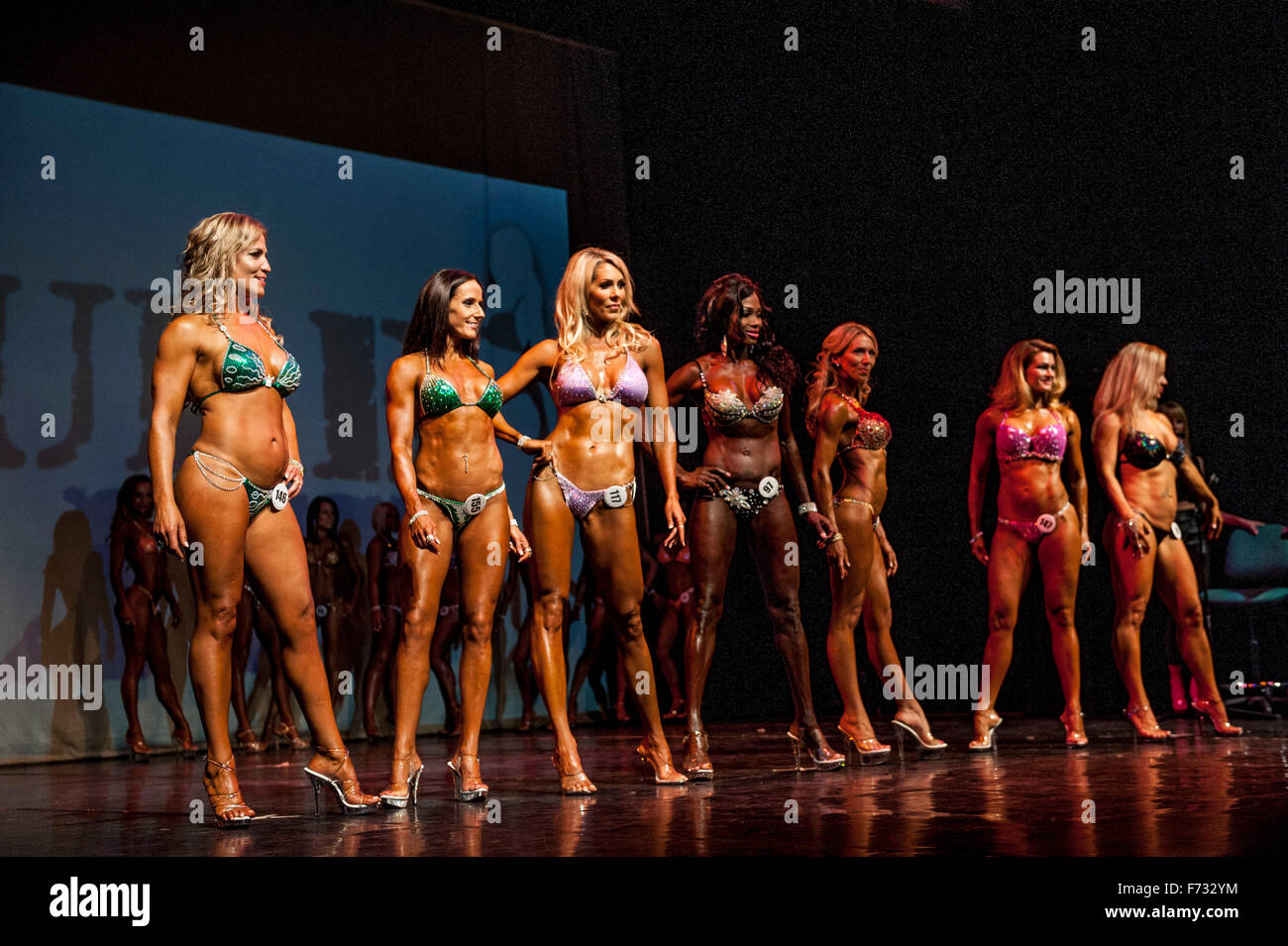 Female fitness models parade in bikini's at The Pure Elite Fitness  Competition @ The Becks Theatre Hayes UK Stock Photo - Alamy
