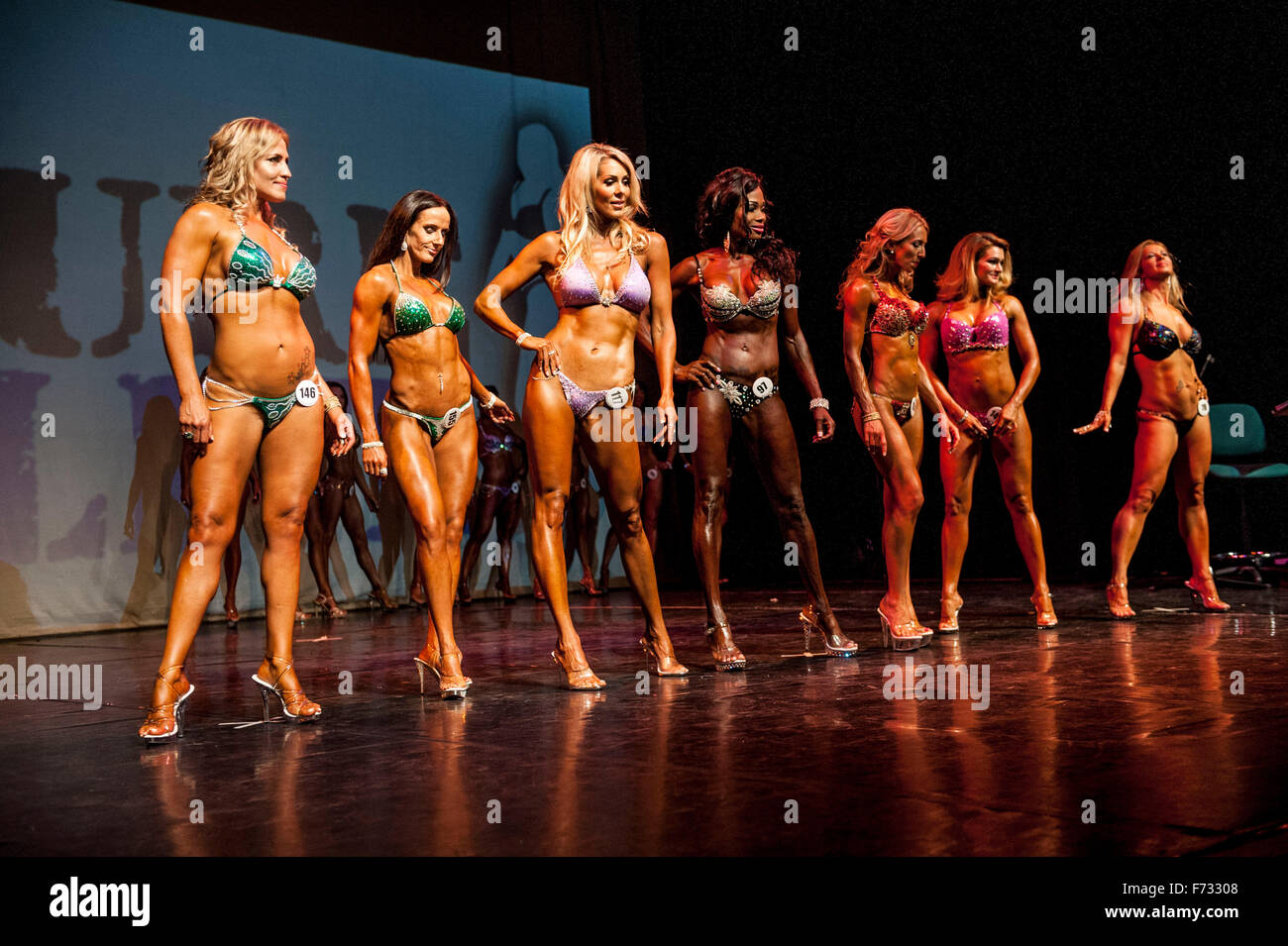 Female fitness models parade in bikini's at The Pure Elite Fitness  Competition @ The Becks Theatre Hayes UK Stock Photo - Alamy