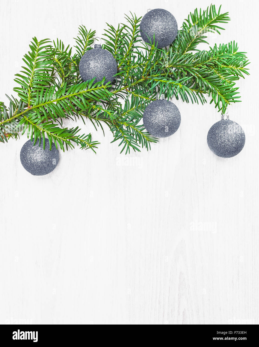 Christmas decorations on a wooden board with copy space. Stock Photo