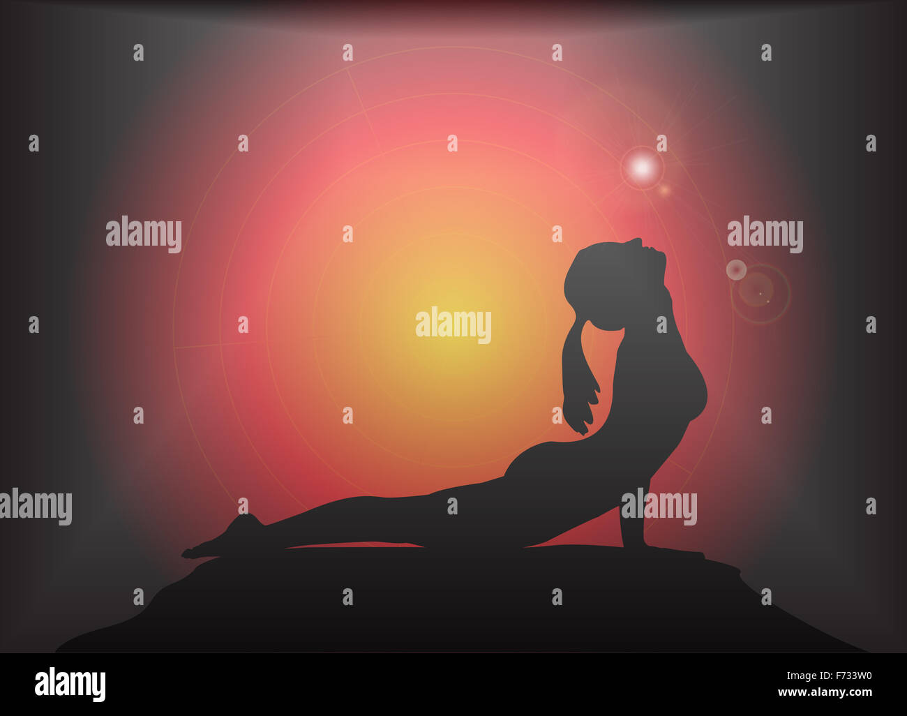 A yoga woman silhouette performing cobra pose on a dark colourful background with a glare Stock Photo