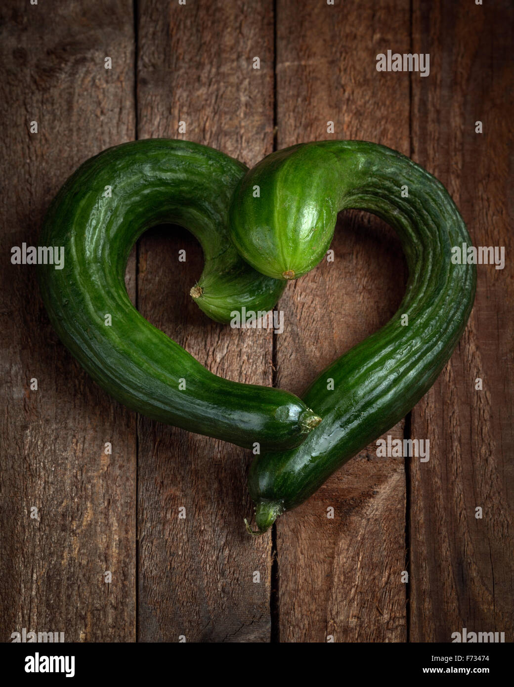 Courgettes arranged in a shape of a heart Stock Photo