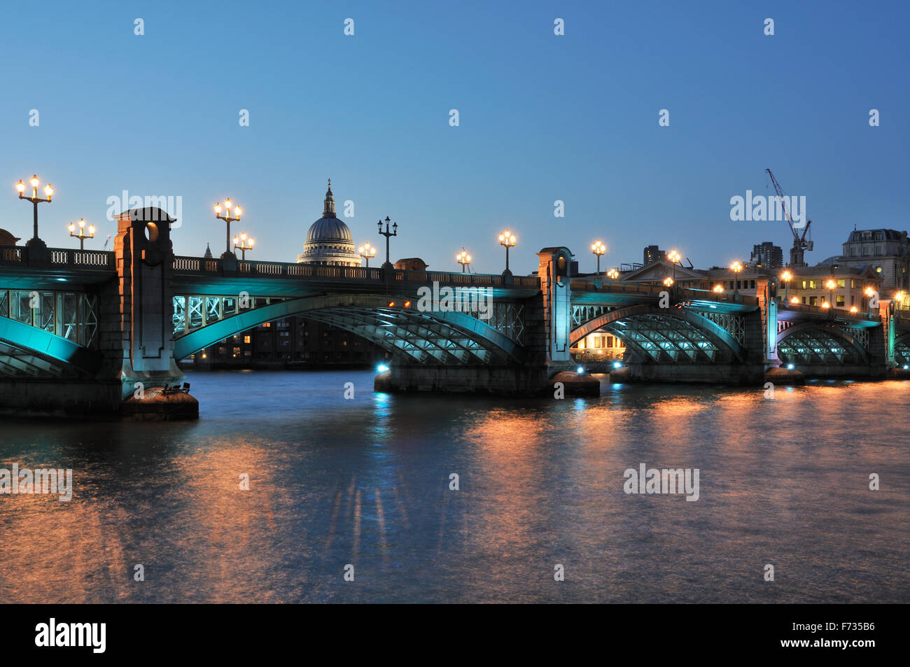 Southwark Bridge London UK floodlit at night Stock Photo