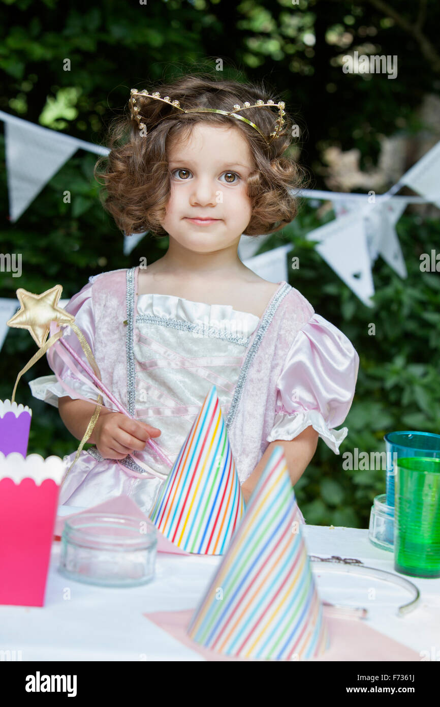 Young girl dressed as a fairy at a garden party. Stock Photo