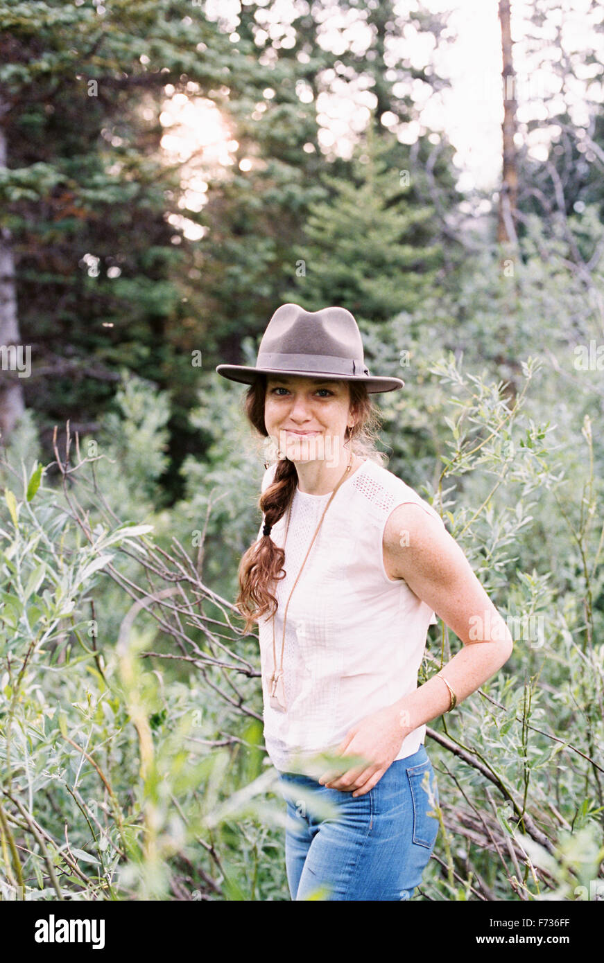 Woman standing wearing hat hi-res stock photography and images - Alamy