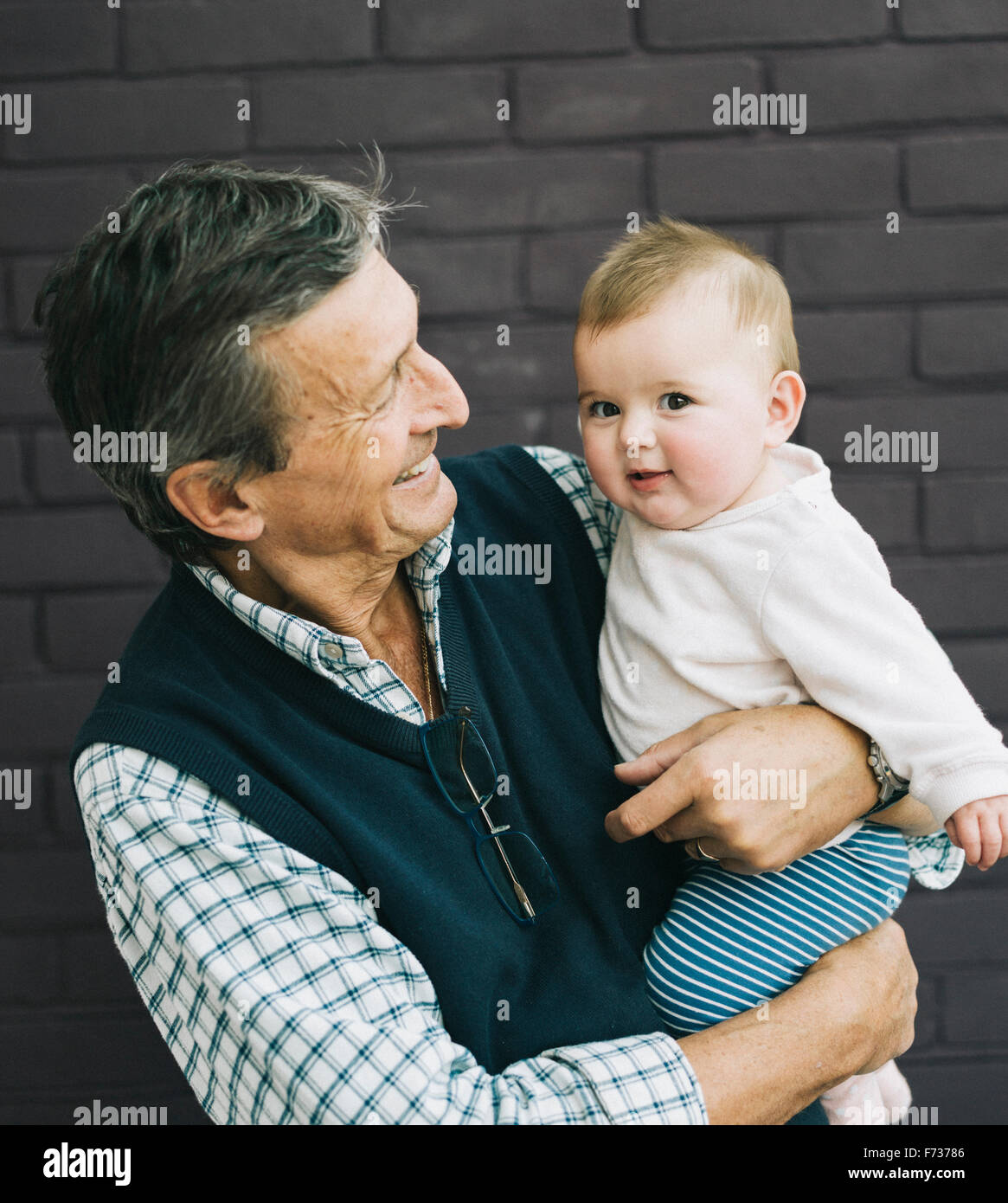 A grandfather and baby granddaughter. Stock Photo