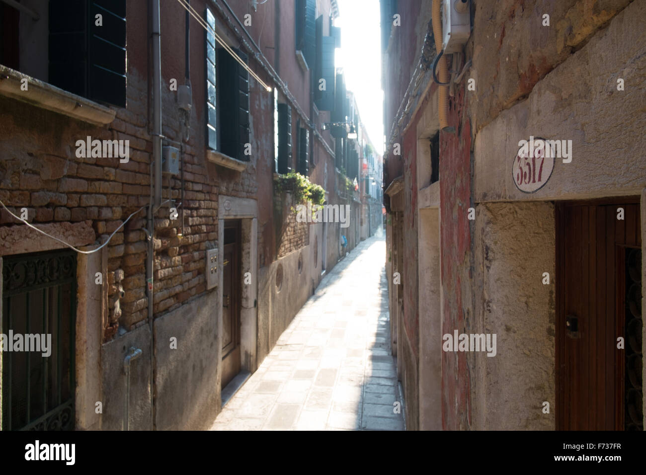Narrow 'Calle' or street, in Castello district, Venice, Italy. Stock Photo