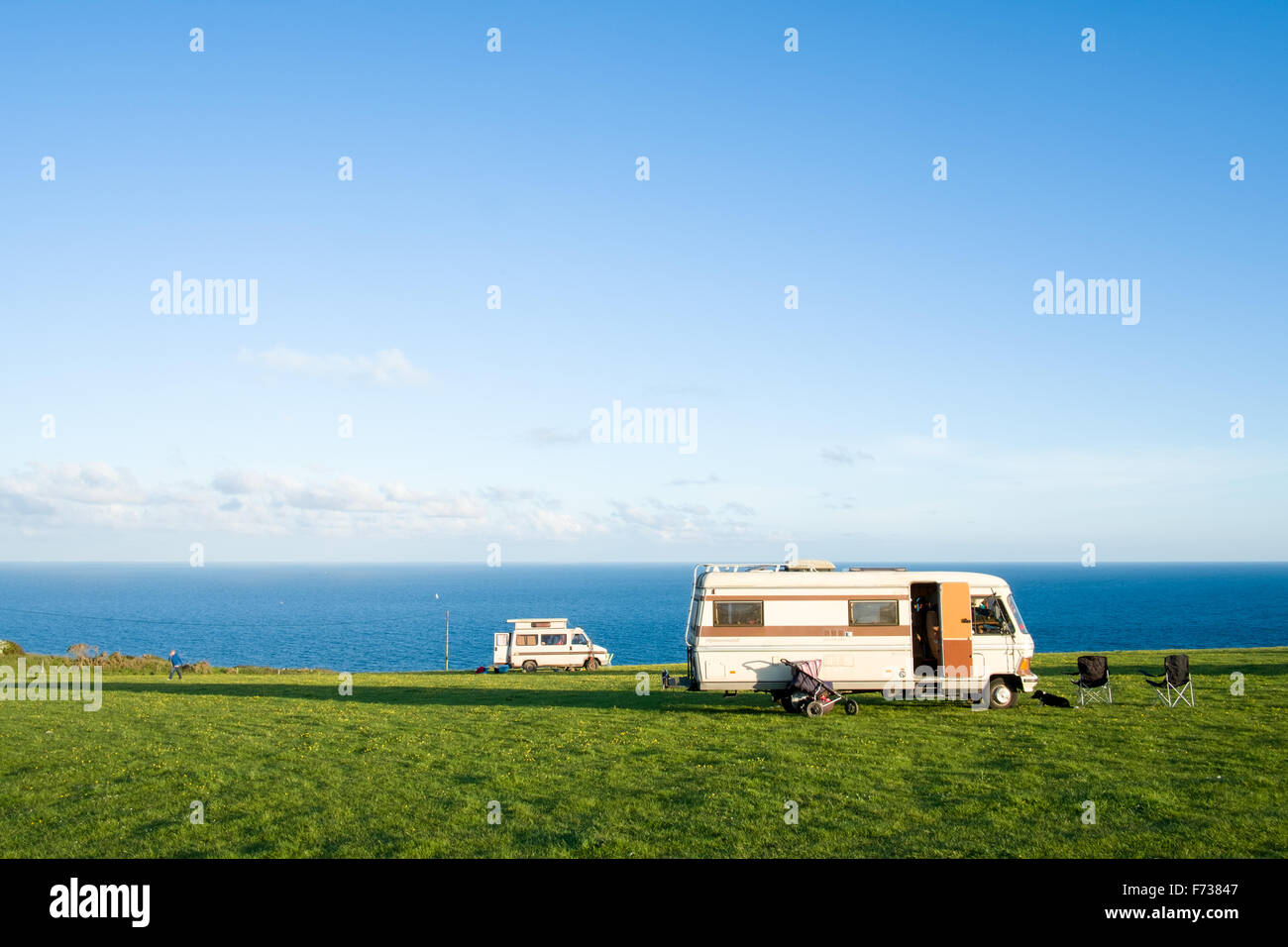 Campervans on camp site with stunning view. East Prawle, Devon Stock Photo