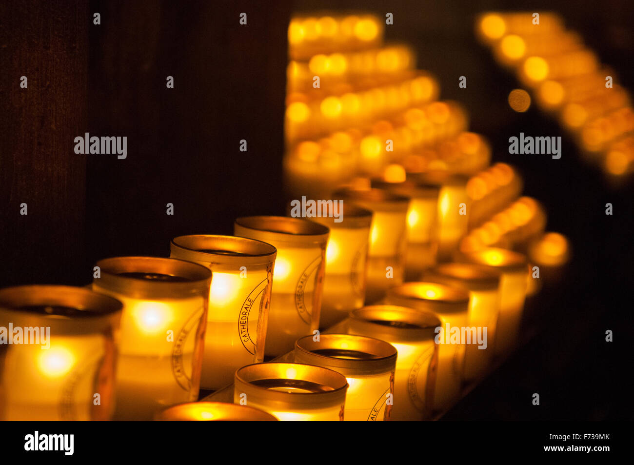 Collection of lit candles in Notre Dame Cathedral, Paris, France Stock