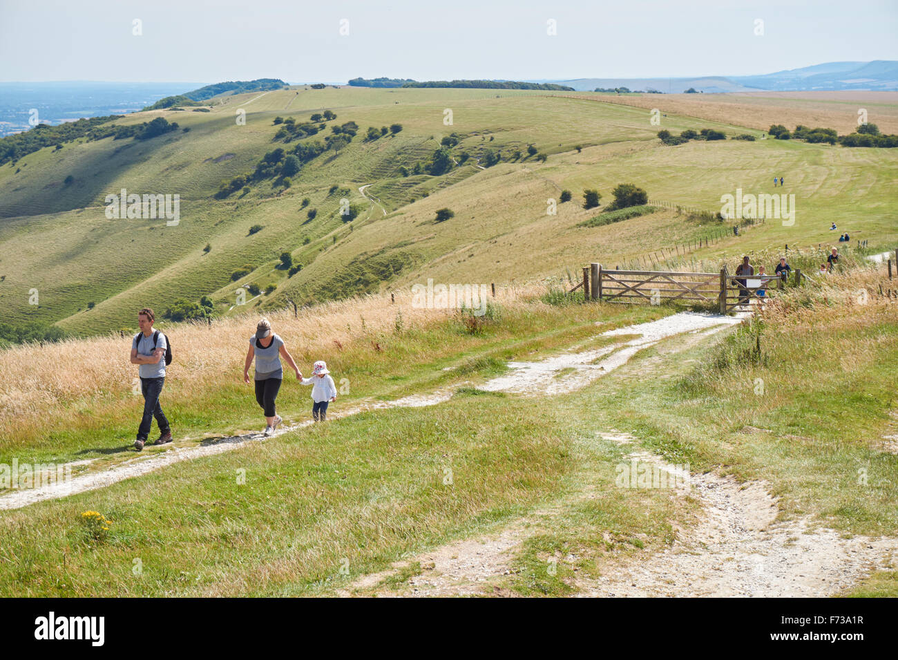 Walkers at Ditchling Beacon on the South Downs Way, the South Downs National Park East Sussex England United Kingdom UK Stock Photo