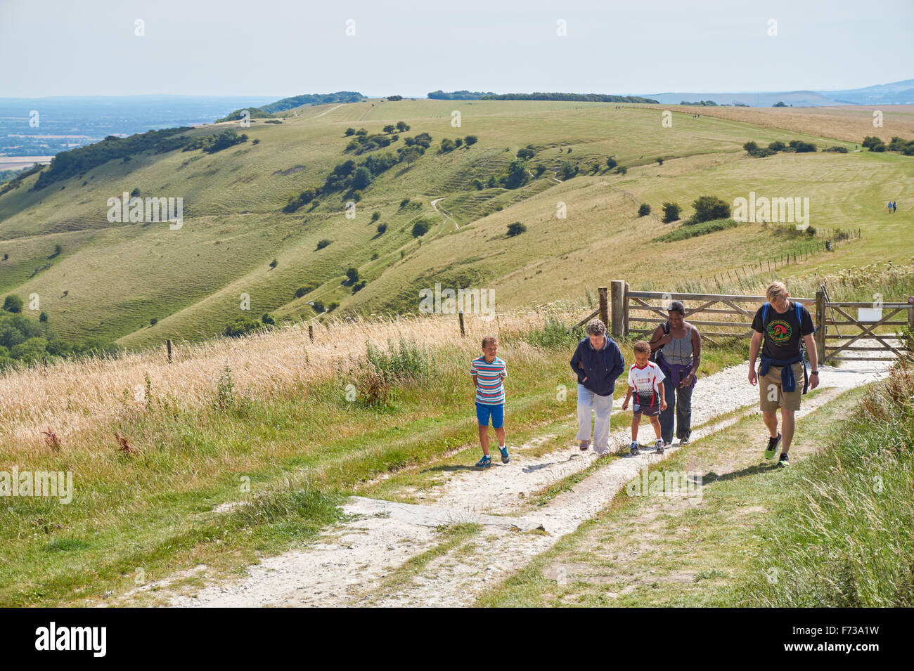 Walkers at Ditchling Beacon on the South Downs Way, the South Downs National Park East Sussex England United Kingdom UK Stock Photo