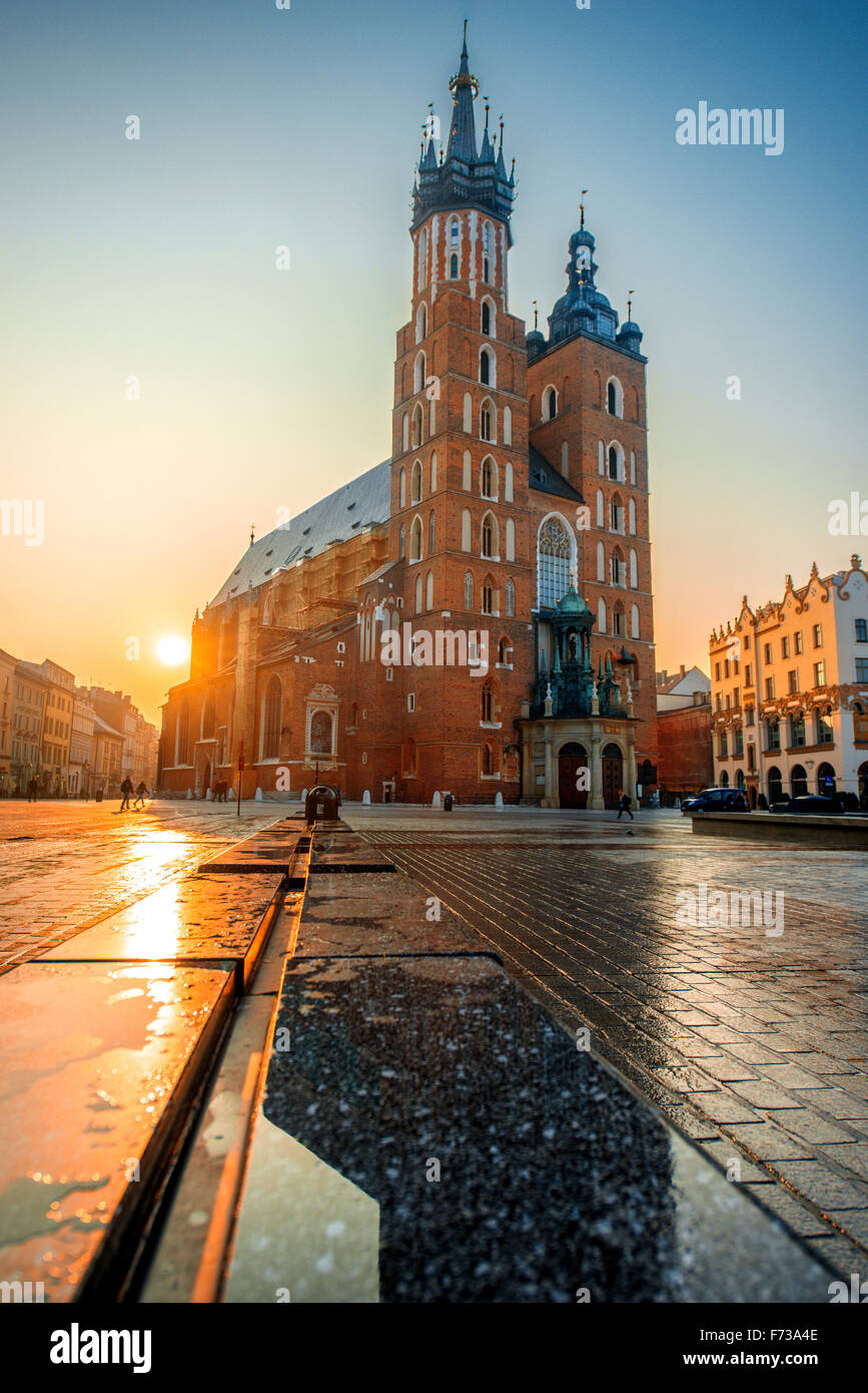 Beautiful view on St. Mary's Basilica at the market square in Krakow on the sunrise Stock Photo