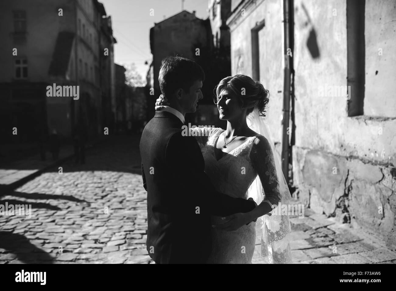 bride and groom posing on the streets Stock Photo - Alamy