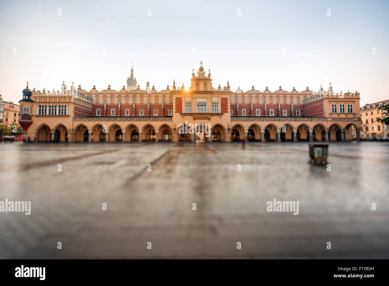 Empty Market square with beautiful Cloth Hall in Krakow on the morning sunrise Stock Photo