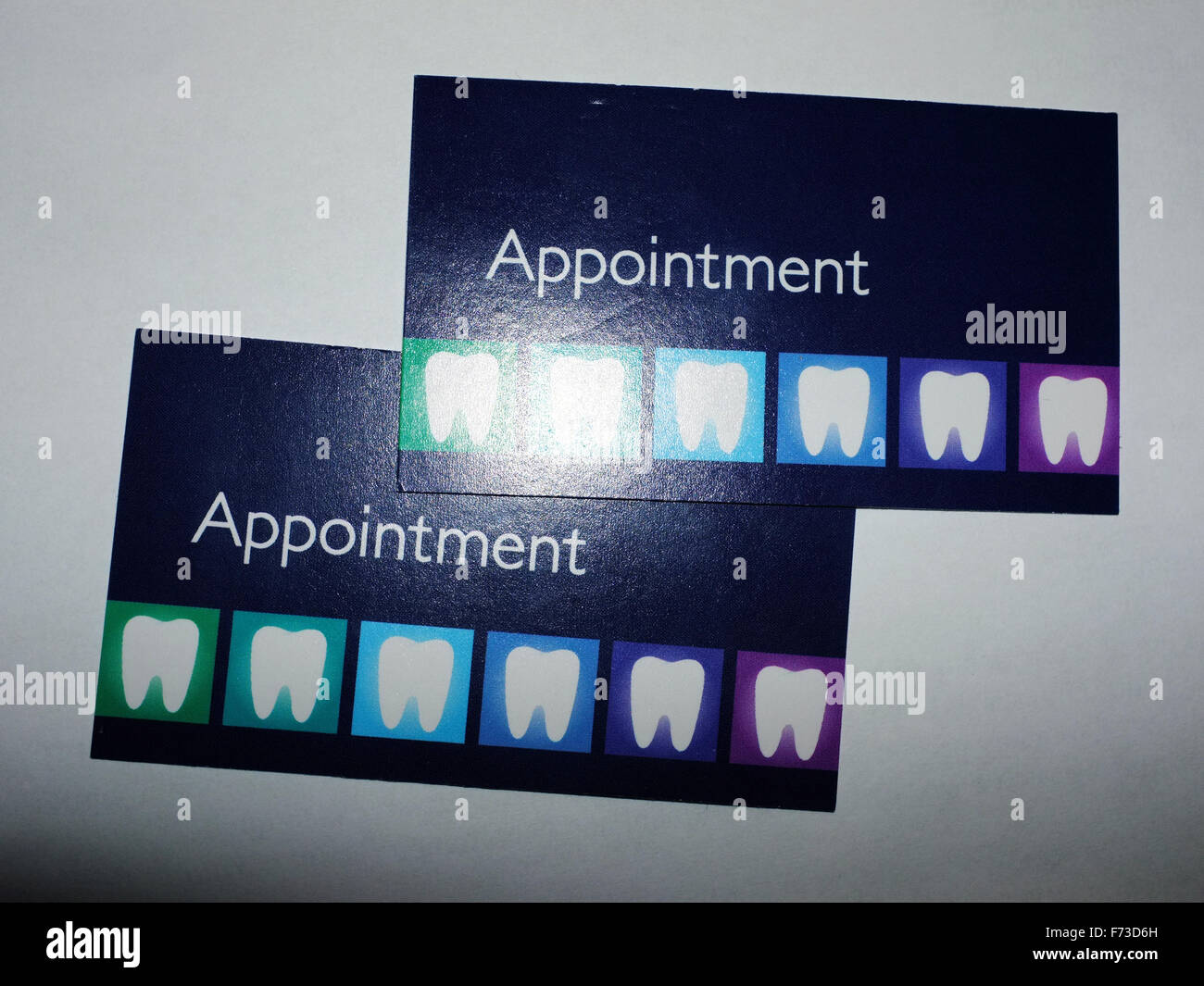 two dentist appointments cards photographed against a white appointments cards