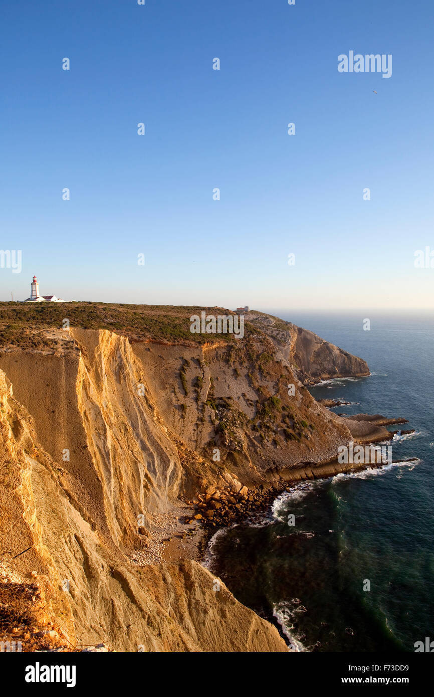 The lighthouse and the impressive cliffs facing the Atlantic Ocean at Cabo Espichel, Cape Espichel, South of Lisbon, Portugal. Stock Photo