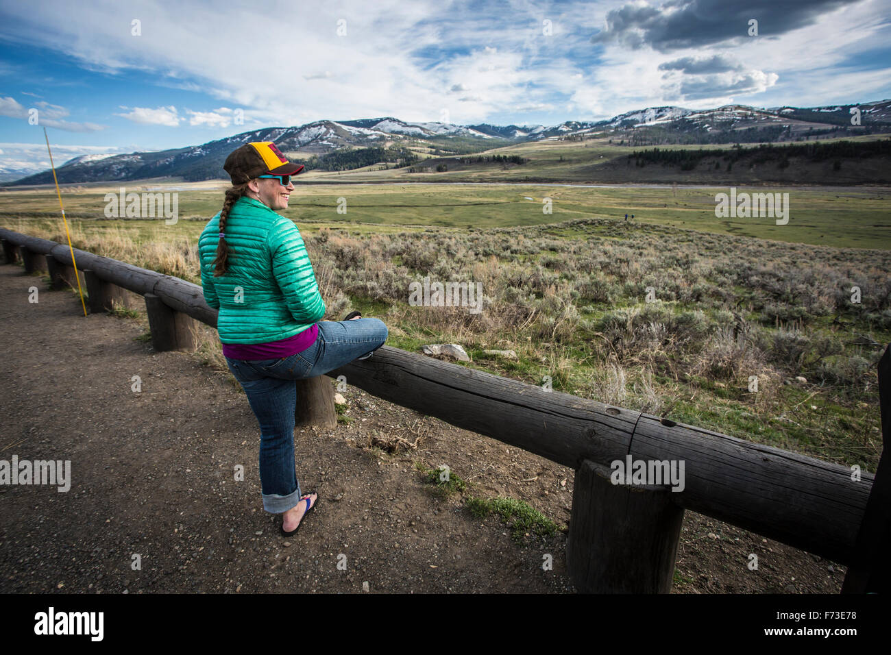A woman overlooks the Lamar Valley in Yellowtone. Stock Photo