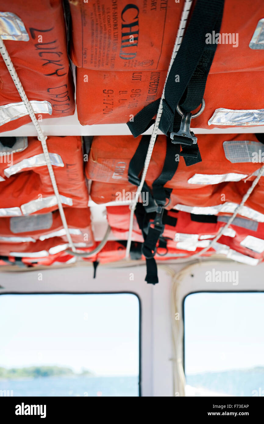 Life Vests on the ceiling of a boat Stock Photo