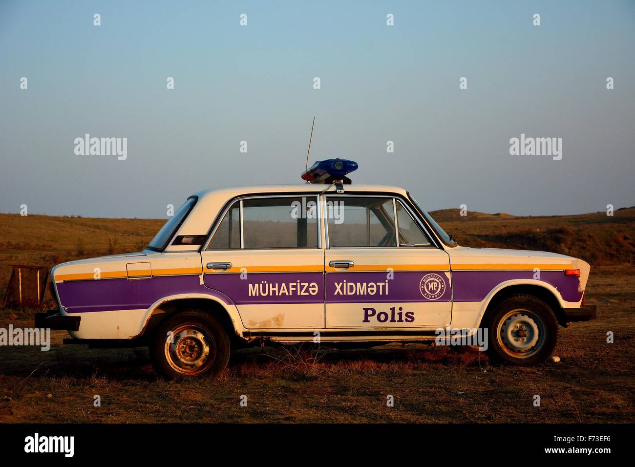 Old Lada police car in Azerbaijani countryside Stock Photo