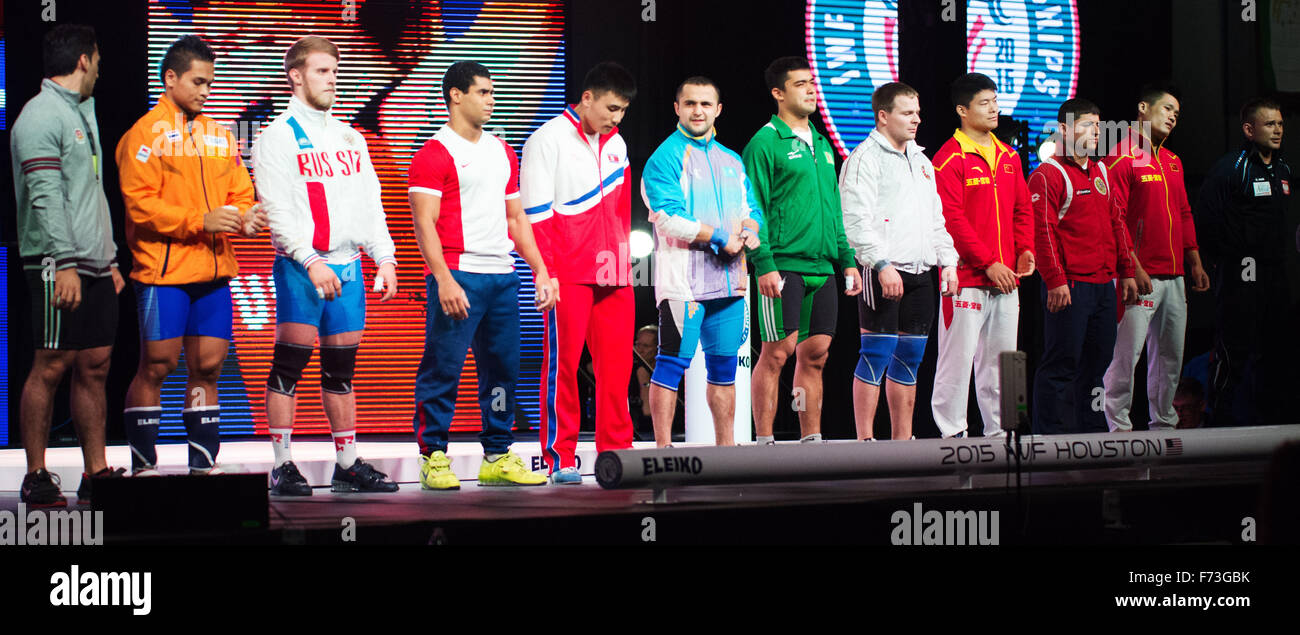 Houston, Texas, USA. 24th Nov, 2015.  The Men's 77 kilogram class stands to be recognized in the traditional introductions ceremony at the World Weightlifting Championships in Houston, Texas. Brent Clark/Alamy Live News Stock Photo