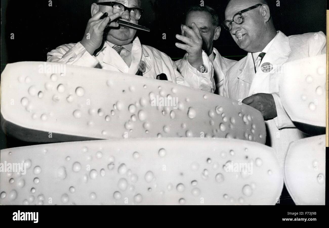 1958 - Who has rolled the cheese to Munich? This is what the expert asked himself during a test of the quality of the cheese, held by the German Agricultural Society on April 2nd in the Munich Salvatorkeller. The cheese lies incognito on the tables so as to guarantee an impartial testing of the quality. 958 samples arrived this year, and they all had to undergo as on our picture the Swiss (emmental) Cheese - a thorough test, including taste, smell, appearance etc. Keystone picture of April 3rd, 1959 © Keystone Pictures USA/ZUMAPRESS.com/Alamy Live News Stock Photo