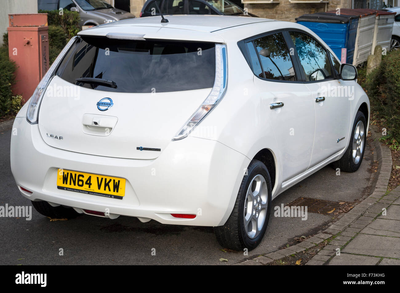 Rear quarter view of Nissan LEAF electric powered car in UK Stock Photo