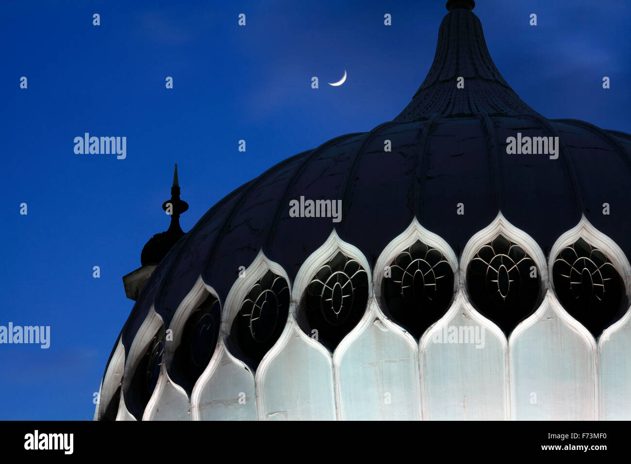 One of the domes on Brighton Pavilion (with moon). Stock Photo