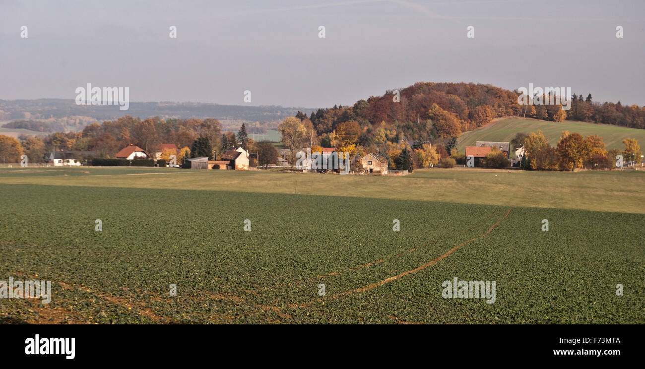 autumn countryside with field, meadow, hills with colorful forest near Plauen city in Vogtland Stock Photo