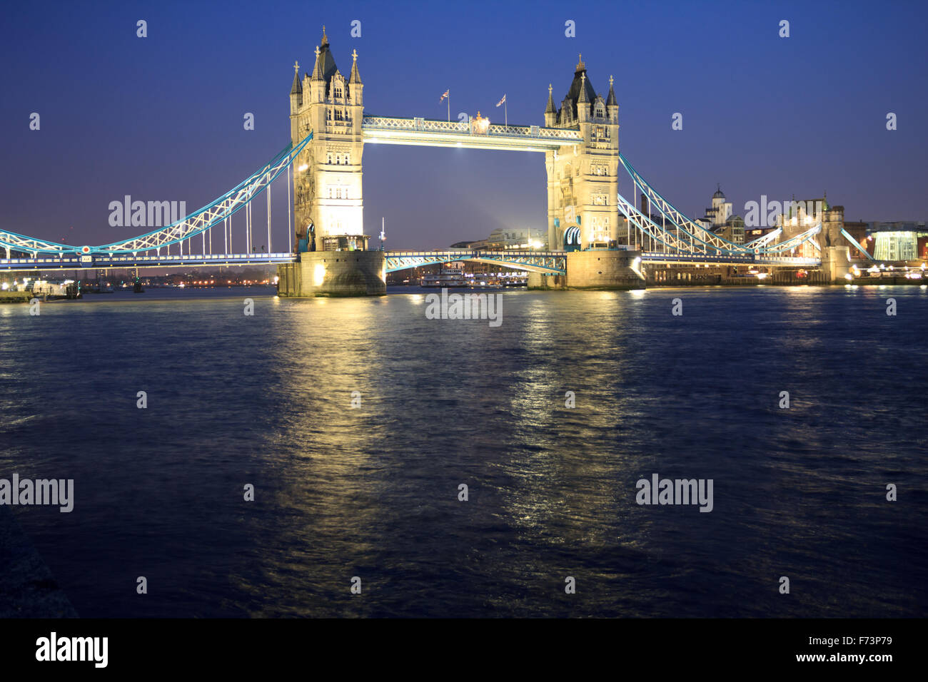 Night scene of the historic Tower Bridge in the calm River THames, London, England Stock Photo