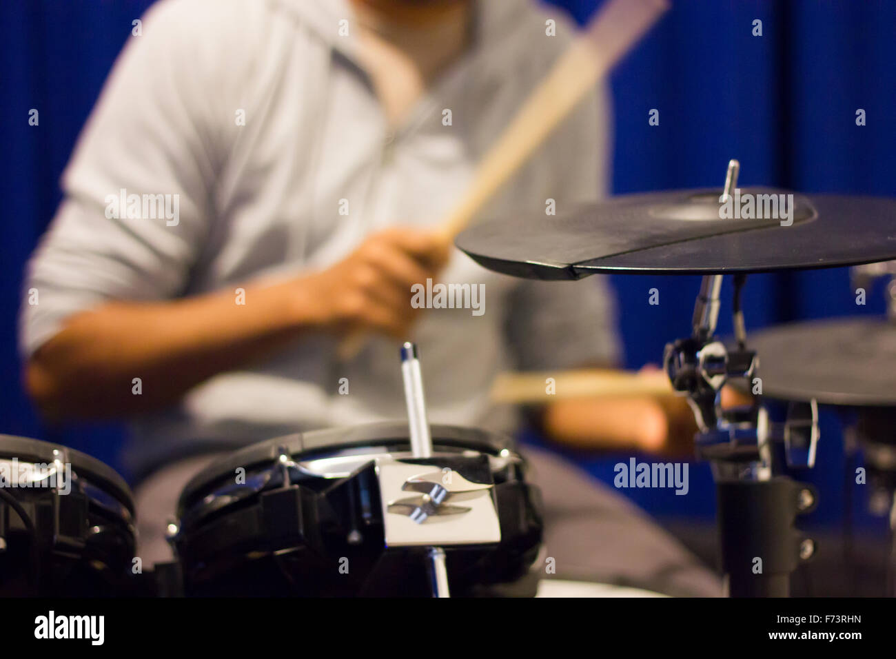 Action shot of a drummer practicing drums Stock Photo