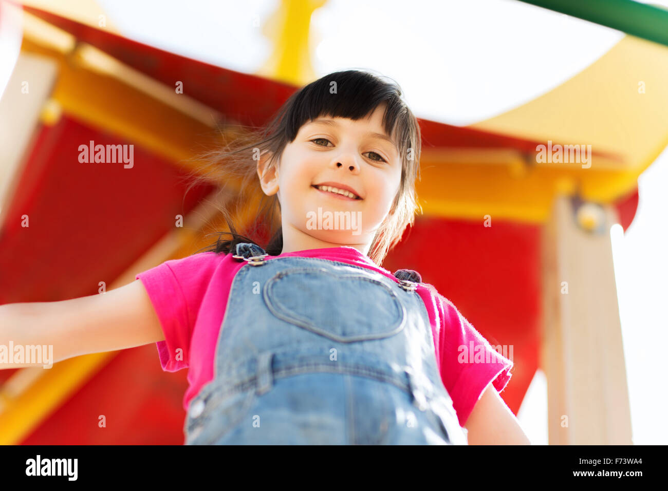 happy little girl on children playground Stock Photo - Alamy