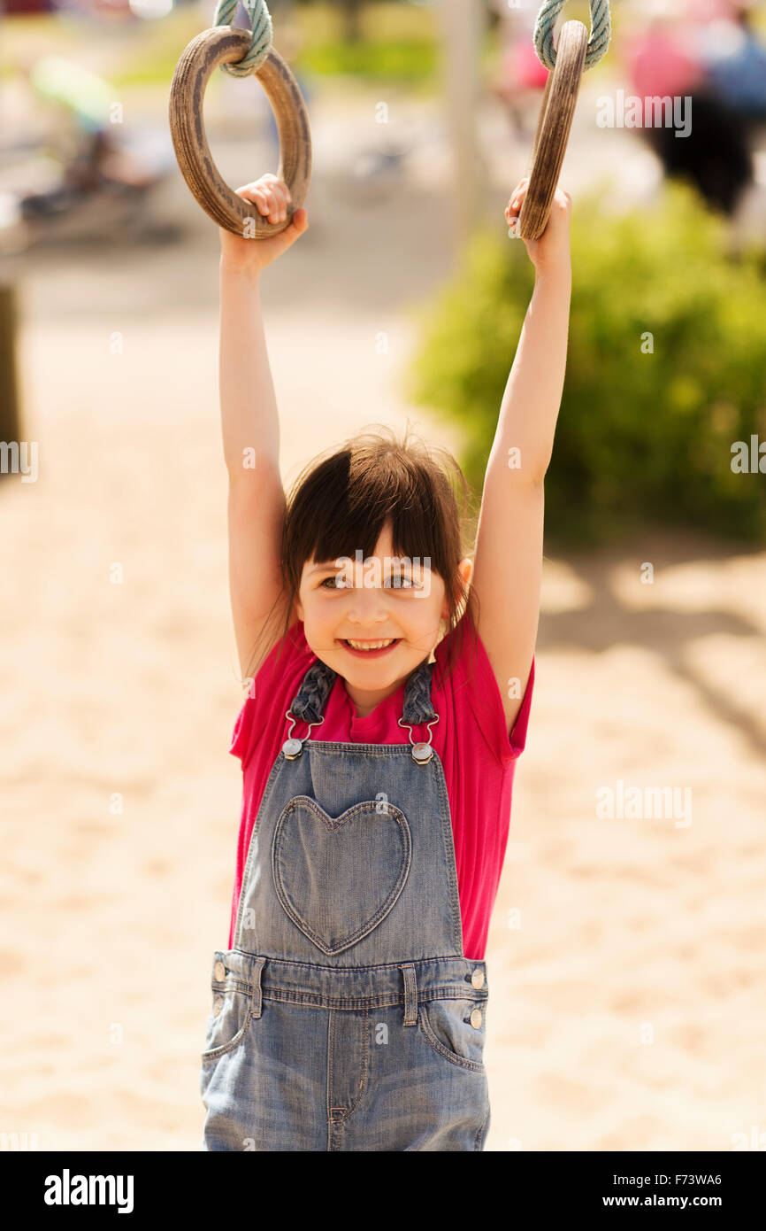 happy little girl on children playground Stock Photo - Alamy
