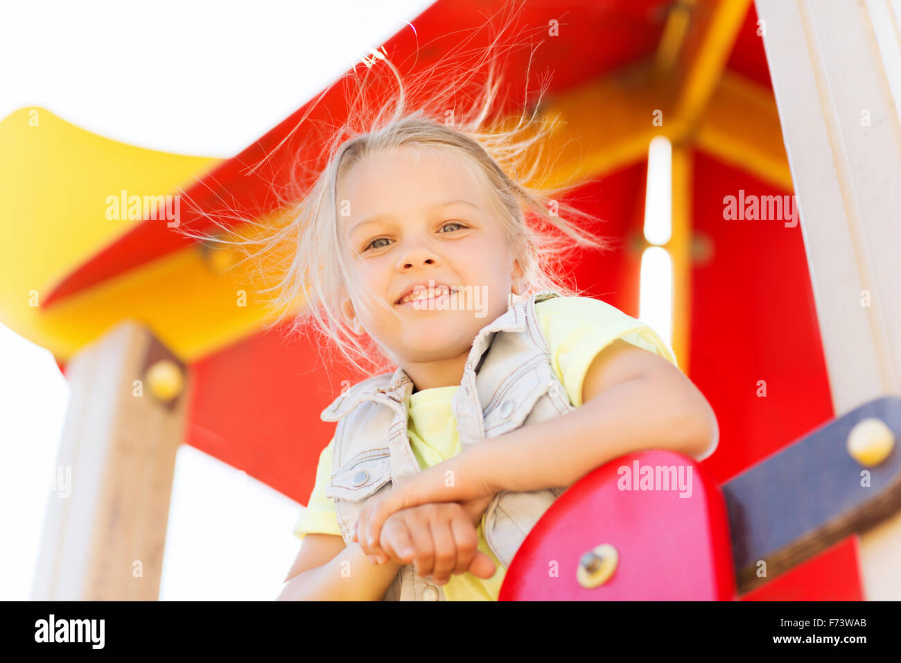 happy little girl on children playground Stock Photo - Alamy