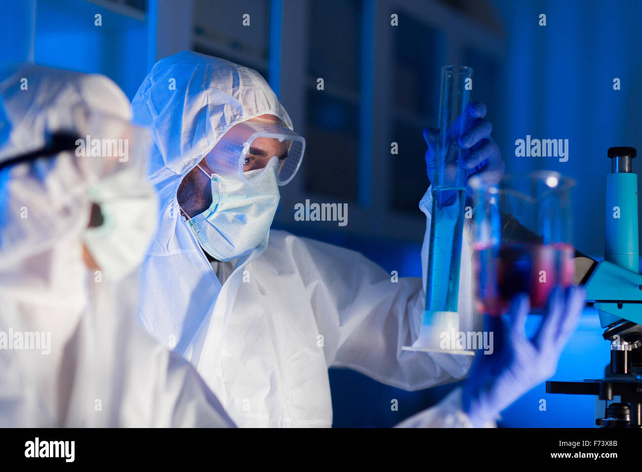 close up of scientists making test in lab Stock Photo