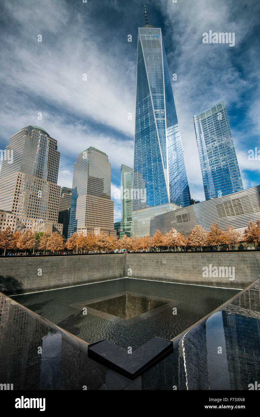 Southern Pool of National September 11 Memorial & Museum with One World Trade Center behind, Lower Manhattan, New York, USA Stock Photo