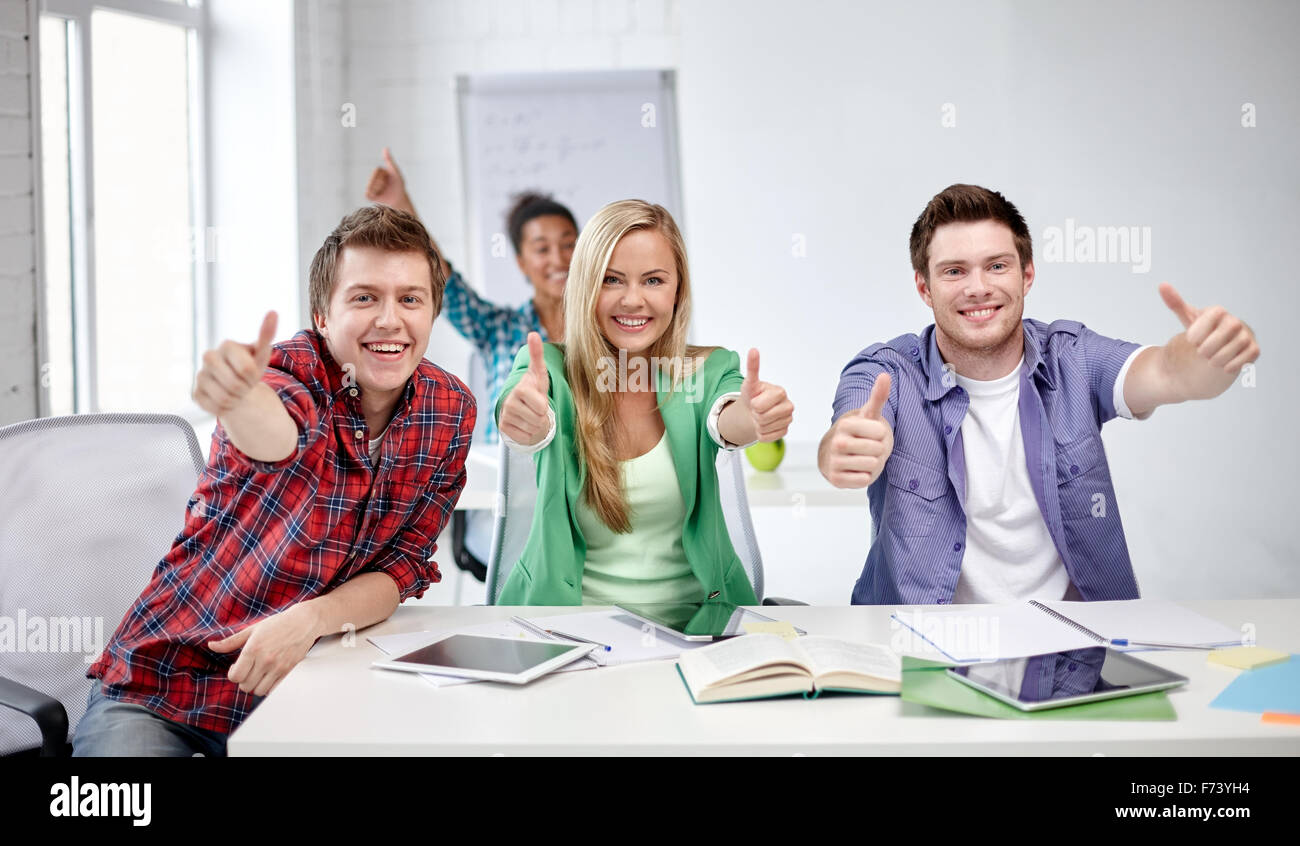 group of happy students showing thumbs up Stock Photo - Alamy