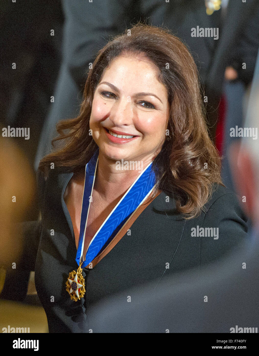 Presidential Medal of Freedom recipient Gloria Estefan wears her award as she departs following the ceremony in the East Room of the White House in Washington, DC on Tuesday, November 24, 2015. The Medal is the highest US civilian honor, presented to individuals who have made especially meritorious contributions to the security or national interests of the US, to world peace, or to cultural or significant public or private endeavors. Photo: Ron Sachs/CNP/dpa - NO WIRE SERVICE - Stock Photo
