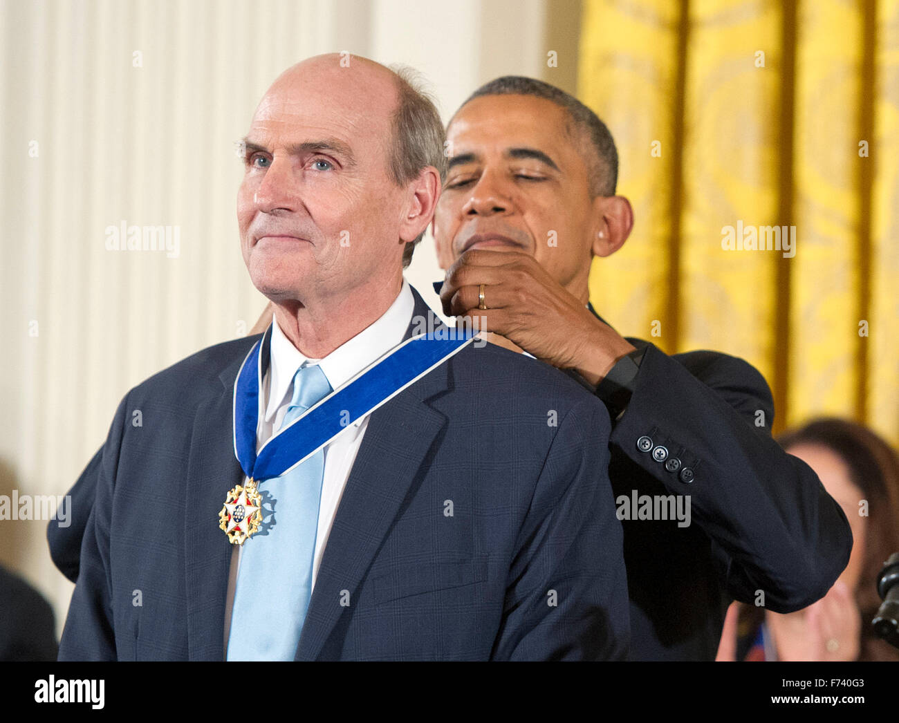 Recording artist James Taylor receives the Presidential Medal of Freedom from United States President Barack Obama during a ceremony in the East Room of the White House in Washington, DC on Tuesday, November 24, 2015. The Medal is the highest US civilian honor, presented to individuals who have made especially meritorious contributions to the security or national interests of the US, to world peace, or to cultural or significant public or private endeavors. Photo: Ron Sachs/CNP/dpa - NO WIRE SERVICE - Stock Photo