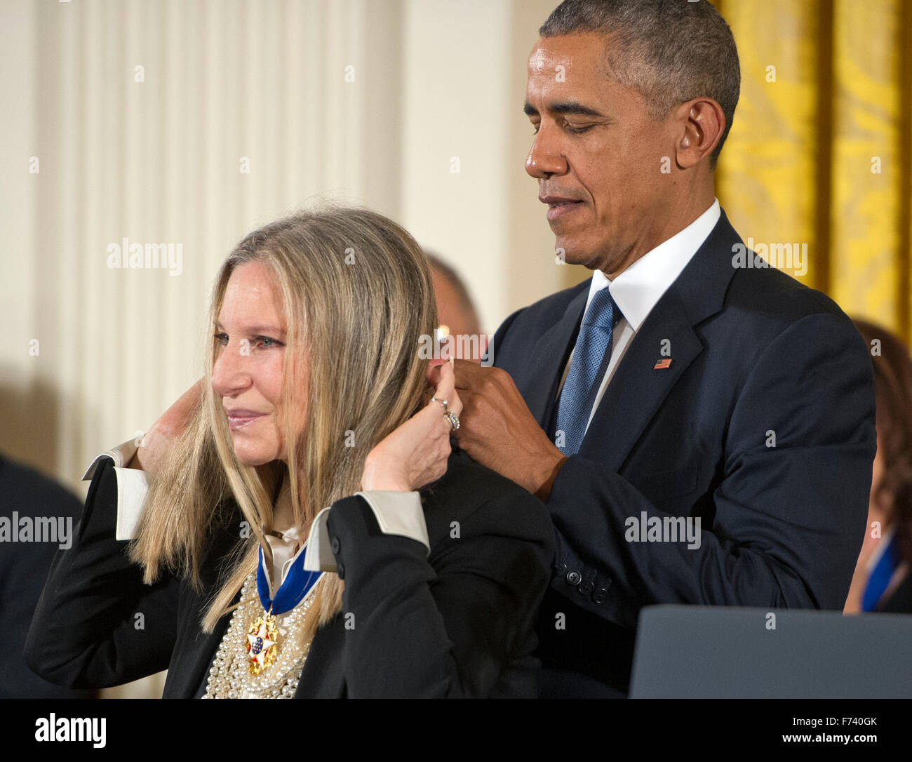 Singer, actor, director and songwriter Barbra Streisand receives the Presidential Medal of Freedom from United States President Barack Obama during a ceremony in the East Room of the White House in Washington, DC on Tuesday, November 24, 2015. The Medal is the highest US civilian honor, presented to individuals who have made especially meritorious contributions to the security or national interests of the US, to world peace, or to cultural or significant public or private endeavors. Photo: Ron Sachs/CNP/dpa - NO WIRE SERVICE - Stock Photo