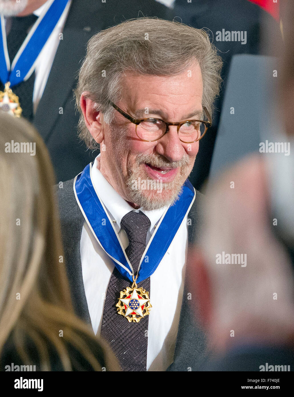 Presidential Medal of Freedom recipient Steven Spielberg wears her award as he departs following the ceremony in the East Room of the White House in Washington, DC on Tuesday, November 24, 2015. The Medal is the highest US civilian honor, presented to individuals who have made especially meritorious contributions to the security or national interests of the US, to world peace, or to cultural or significant public or private endeavors. Photo: Ron Sachs/CNP/dpa - NO WIRE SERVICE - Stock Photo