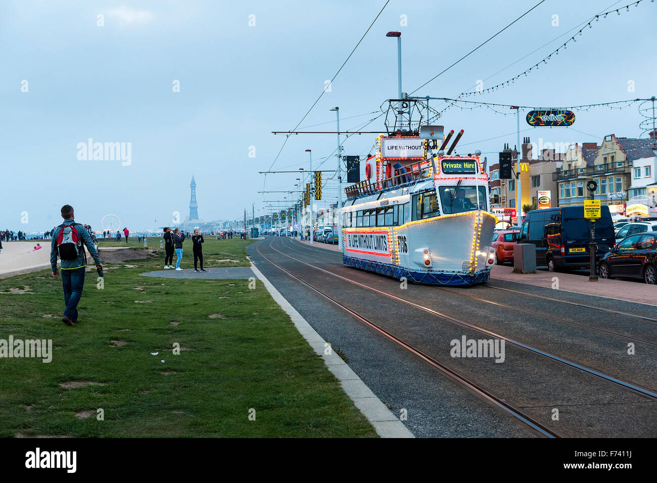 Blackpool tram with lights early on an October evening Stock Photo Alamy
