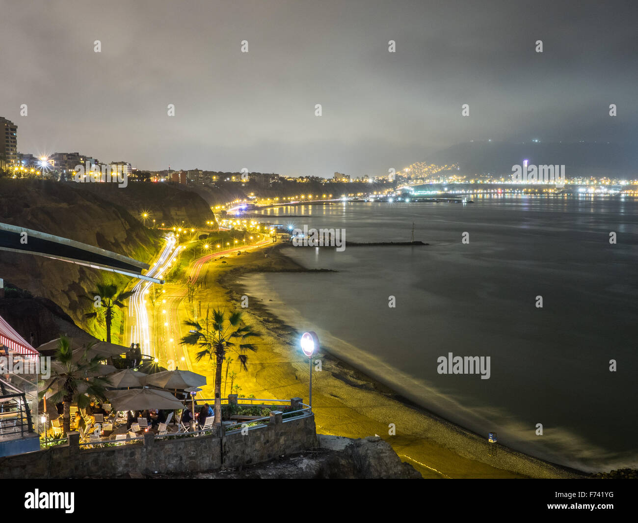 Night in Lima watching the pacific ocean and the Costa verde traffic Stock Photo