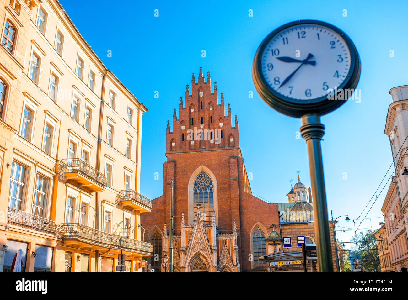 View on Holy Trinity church with city clock in Krakow town Stock Photo